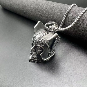 Detailed view of a vintage stainless steel Viking Odin helmet guardian bell pendant