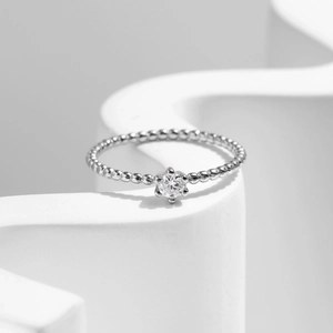 Minimalist S925 sterling silver beaded ring with sparkling round-cut moissanite centerpiece