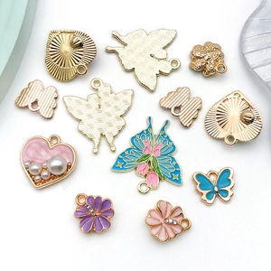 Detail of colorful enamel butterfly and flower charms for DIY jewelry making