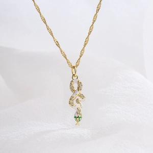 18K gold plated snake pendant necklace with white enamel and green zircon accents