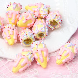 Macro view of hand-painted ice cream cone acrylic beads for DIY jewelry and phone charms