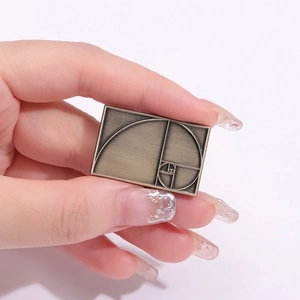 Vintage bronze rectangular brooch featuring a golden ratio spiral on brushed alloy