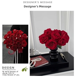 Macro detail of red velvet roses with pearls in a modern black spherical vase