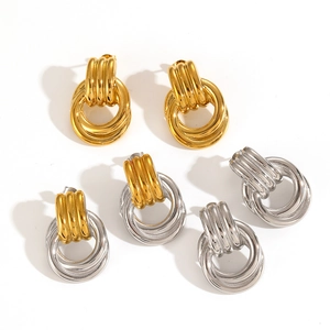 Three pairs of geometric 18k gold and silver stainless steel hoop earrings in a studio set