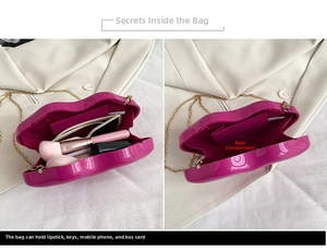 Detailed view of fuchsia lip-shaped box bag interior capacity and gold chain strap