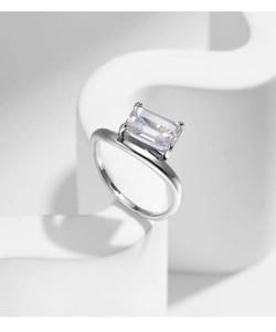 Macro shot of s925 silver ring with a large rectangular gemstone on white pedestal