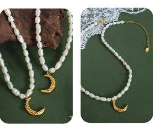 Macro shot of gold moon pendant with texture and freshwater pearl necklace detailing