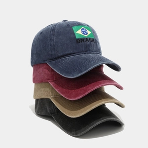 Vertical stack of washed cotton baseball caps with Brazil flag embroidery in various colors