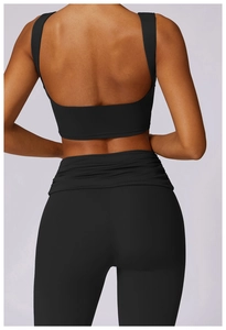 Close-up of black yoga set showing high-waist leggings with unique layered waist detail