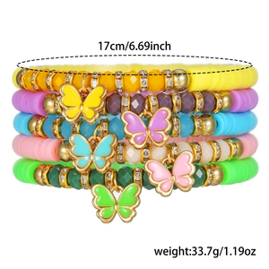 Detailed view of 5-piece colorful fruit butterfly polymer clay beaded bracelets set