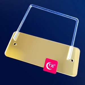 Detail of golden acrylic earring stand base with transparent U-shaped support