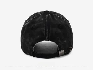 Rear view of washed black cotton baseball cap showing adjustable strap and metal buckle