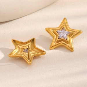 Elegant 18K gold-plated stainless steel star earrings with clear zircon stones on a beige base