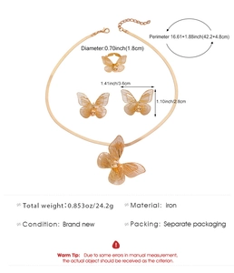 Golden butterfly jewelry set details with hollow metal texture necklace and earrings