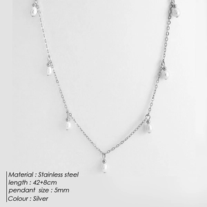 Detail of silver stainless steel necklace with 5mm white pearls and 42+8cm chain