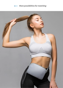 Close-up of grey waterproof belt bag worn by a model in a fitness setting