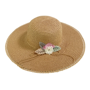 Summer wide brim straw hat with lace flower details for beach sun protection