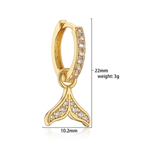 Macro detail of 18K gold plated fishtail earrings with micro-pave cubic zirconia accents
