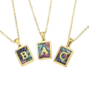 Square gold stainless steel necklaces with shell inlay and letters ABC on white background