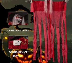 Detail of red Halloween hanging witch showing glowing head and internal sound motor