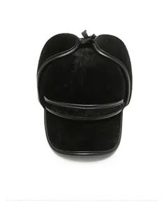 Top down view of black faux mink fur winter hat with earflaps and leather trimming