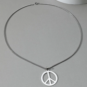 Detail view of silver stainless steel peace sign pendant with classic round box chain