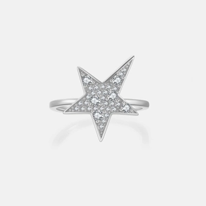 Macro shot of silver five-point star ring with pavé-set shimmering cubic zirconia detail