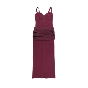 Close-up of wine red lace detailing and bustier bodice on long backless dress