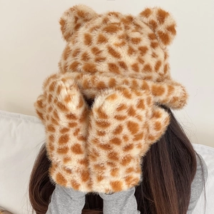 Detail view of plush deer pattern hat and mittens set with cute 3D ears for winter warmth