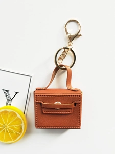 Brown lychee leather mini tote keychain with golden snap button and lobster clasp hardware