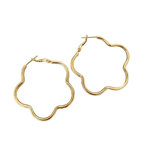 Minimalist golden flower hoop earrings with metal petal design on white background