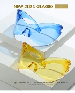 Blue and yellow Y2K rimless sunglasses displayed on geometric steps with UV400 details