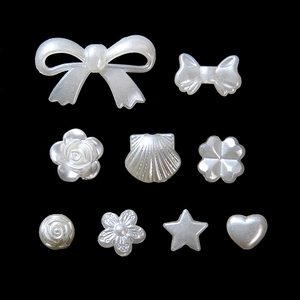 Detailed assortment of white baroque style imitation pearl beads in various shapes