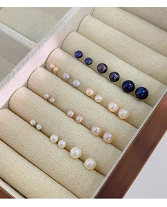 Detailed collection of natural freshwater pearl studs in white pink and black colors