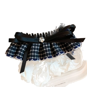 Elegant banana hair clip with black satin bow and blue houndstooth fabric design