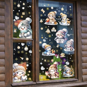 Christmas snowman window stickers with snowflakes and decorative balls on a wooden frame