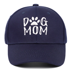 Dark blue cotton baseball cap with white DOG MOM embroidery and paw print on front