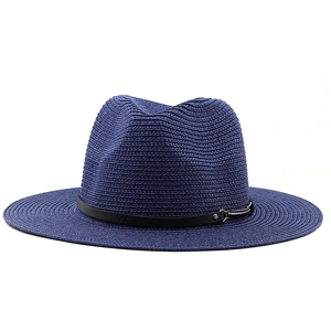 Detail of navy blue straw fedora with spiral woven texture and black leather strap