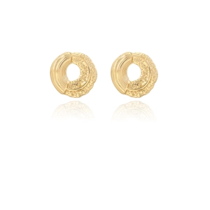 Detailed macro shot of golden round earrings with textured brushed and hammered finish