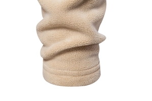 Detailed macro view of the thick apricot polar fleece fabric and high-quality stitching