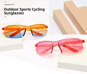 Detail of polarized frameless cycling sunglasses in blue-orange and pink gradient lenses