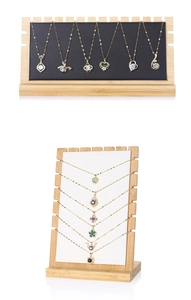 Bamboo necklace display stand featuring six slots with black and white PU leather liners