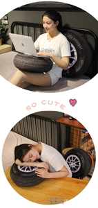 Detail of 3D tire plush cushion with wheel rim print and Good Luck slogan