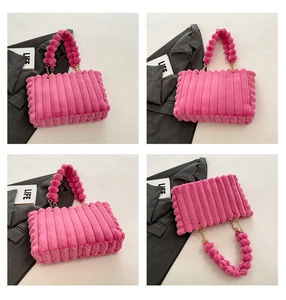 Close-up of pink plush tote bag showing ruffled textures and spherical fur handle detail