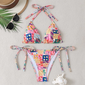 Women's two-piece bikini set with tropical fruit print and side tie bottoms