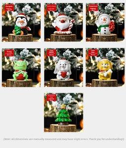 Detailed view of 7 mini resin Christmas figurines including Santa and reindeer on wood
