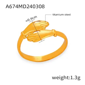 Macro view of golden titanium steel hug ring showing 0.9cm width and 1.3g weight detail