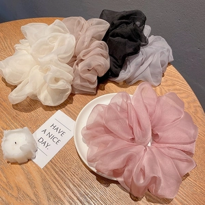 Detailed set of five organza scrunchies in white, beige, black, gray, and pink colors