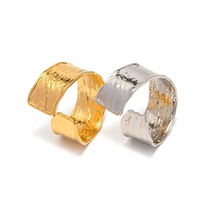 Adjustable 18K gold and silver plated stainless steel rings with hammered metal texture