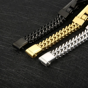 Macro detail of bike chain bracelets in black, gold and silver stainless steel finishes